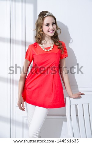 fashion smile model with chair posing