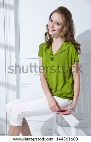 portrait of Young casual woman style sitting chair posing