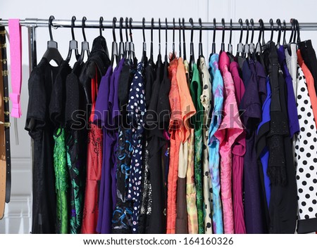 female colorful clothing on hangers  female colorful clothing on hangers