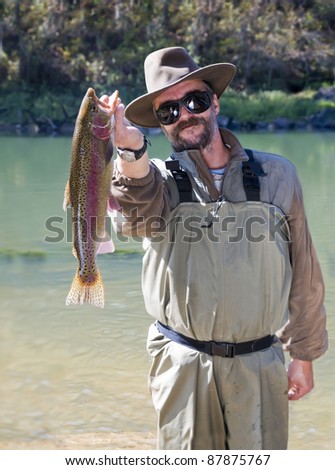 Fisherman caught a big rainbow trout on the Little Red River (Arkansas)