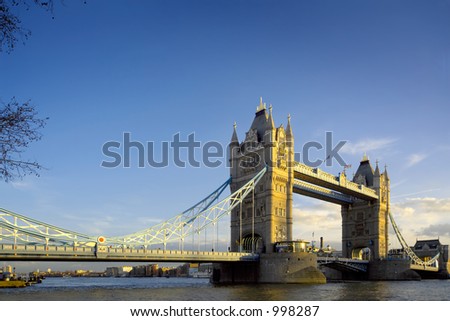 Tower Bridge in London, evening light and blue sky.  Space for copy.