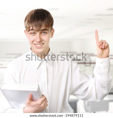 Cheerful Student pointing with Finger up in Classroom