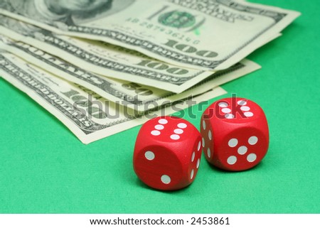 red dices on green background
