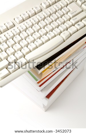 book and computer keyboard, concept of online learning