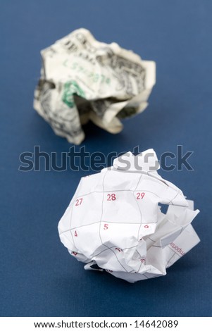 Calendar paper ball and dollar, concept of Wasting Time and money