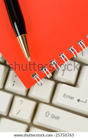 Red Note Pad and Keyboard close up