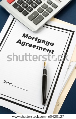Mortgage Agreement and calculator close up