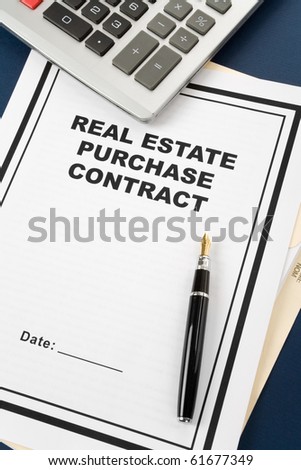 Real Estate Purchase Contract and pen, business concept