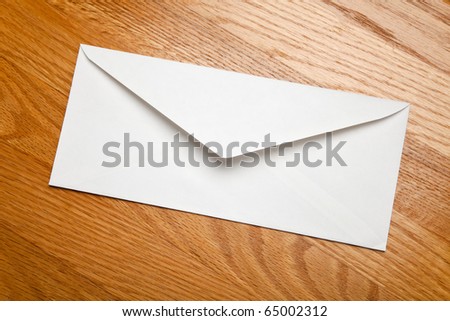 White Envelope on wood tabletop