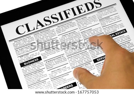 Fake Classified Ad, newspaper and Touch Screen, business concept.