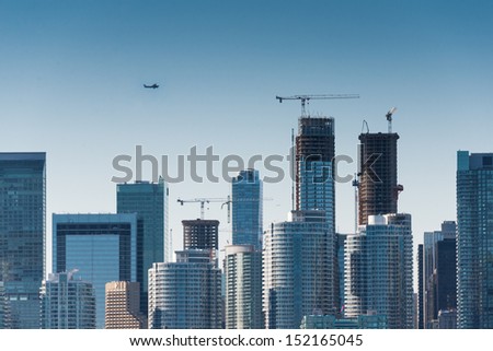 Plane flys over the city (Building signs are removed)