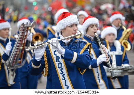 TORONTO - NOVEMBER 17: The marching band attends the 109th Toronto Santa Claus Parade in Toronto, Canada on November 17, 2013.