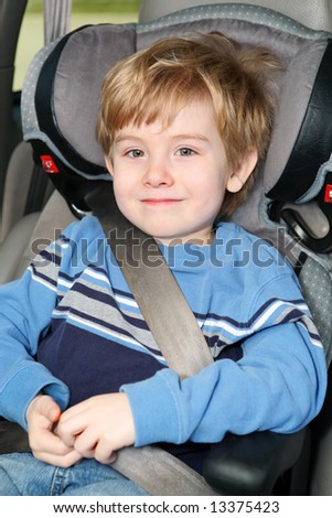 Young boy in a booster seat