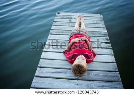Boy dreaming on a summer\'s day