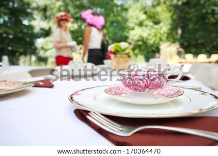 Tea cup and place setting at a tea party