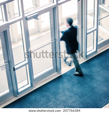 Man walking out of a business office