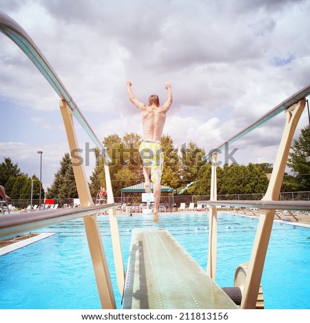 Young man diving off a diving board
