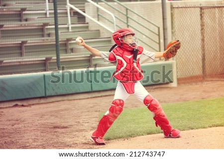 Catcher in baseball throwing the ball