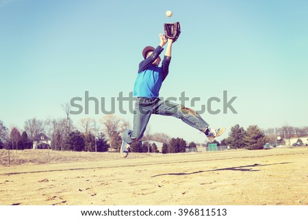 Boy catching a baseball, sandlot baseball, focus on shirt. Stock foto © 
