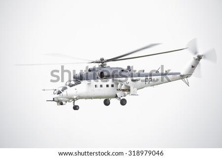 Roudnice nad Labem, CZECH REPUBLIC - JUN  27.: Czech Air Force Mi-24 attack helicopter flying a demonstration at the MEMORIAL AIR SHOW 2015 on June 27., 2015 in Roudnice nad Labem, Czech republic.