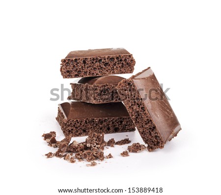 Stack of chocolate pieces on a white background