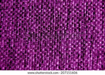 Pink / purple fabric wallpaper background close-up