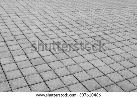 Grey brick stone street road. Light sidewalk, pavement texture
