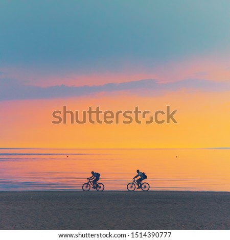 Similar – Image, Stock Photo Active sporty couple riding mountain bikes on demanding forest trail.