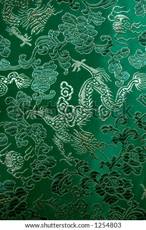 Oriental green silk with dragon pattern.