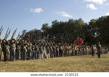 Confederate Troops perform a rifle salute.