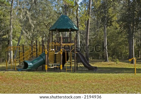 Modern playground equipment with slides and jungle gyms.