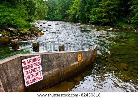 The opening to the fish ladder for salmon and trout, so they may pass by the hydroelectric generators, on the Snoqualmie River, near North Bend, Washington.