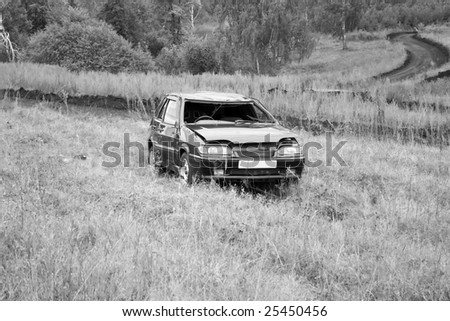 Accident on a car race. Broken auto. Black and white photo