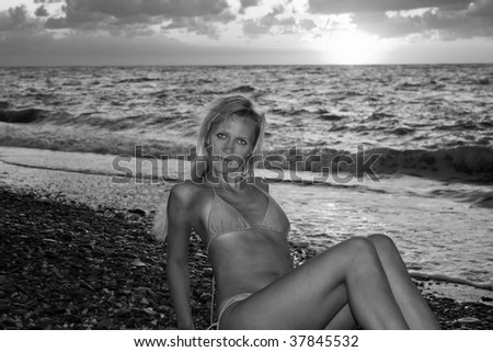 Young girl on a beach of Black Sea. Black and white photo