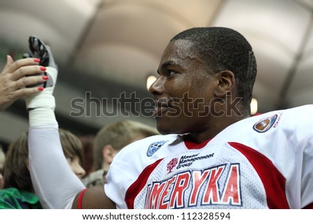 WARSAW, POLAND - SEPTEMBER 1: American football player from US team Kesnel Menard (LB) greets fans after winning the match during Euro-American Challenge on September 1, 2012 in Warsaw, Poland.
