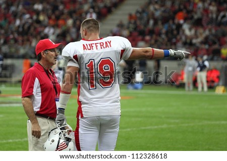WARSAW, POLAND - SEPTEMBER 1: American football player, US team member Kyle Auffray (TE) talks to the team couch during Euro-American Challenge match on September 1, 2012 in Warsaw, Poland.