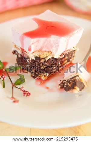 Raspberry mousse cake with biscuits and coca.