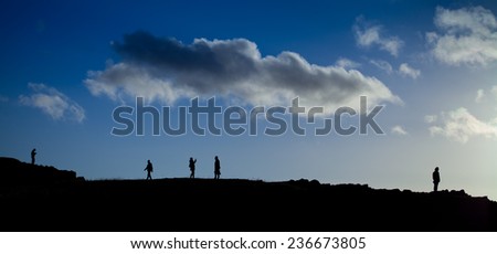 Group of people on a Scottish hill- Arthur Seat. Landscape view. Scottish landscape. sunset, view, tourism, traveling, walking.