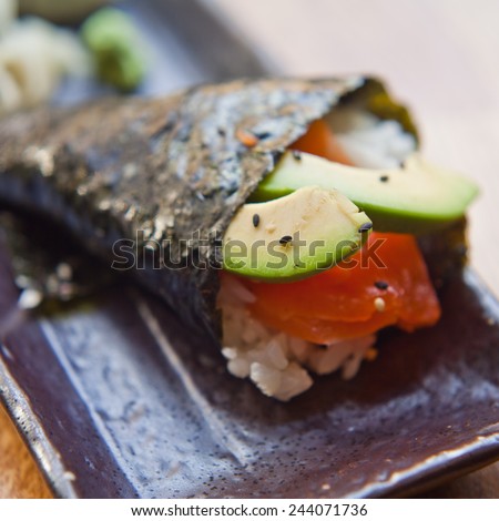 Sushi prepared with rice, raw salomon, wahhabi sauce, majo, soya sauce, and avocado. You can find it at japanese restaurant. Japan, japanese food, Asia