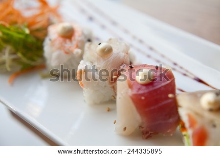 Sushi prepared with rice, raw tuna, raw salmon, wahhabi sauce, majo, soya sauce, prawn and avocado. You can find it at japanese restaurant. Japan, japanese food, Asia