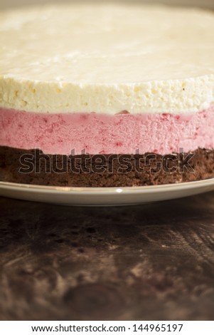 Chocolate mousse cake and strawberries with remaining cake background
