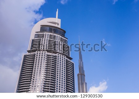 DUBAI, UAE - FEBRUARY 3: The Address Downtown Dubai hotel, the 6th-tallest building in Dubai, UAE and the 36th-tallest in the world and  Burj Khalifa, the tallest in the world, on February 3, 2013.