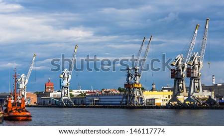 GDANSK, POLAND - JULY 11: Cranes on the quay on July 11, 2013, in the Port of Gdansk - the largest seaport in Poland, a major transportation hub in the central part of the southern Baltic Sea coast.