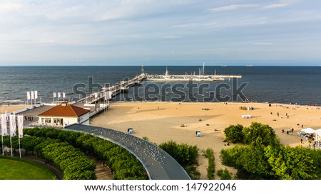 SOPOT, POLAND - JULY 13: Aerial view on the wooden pier in  Sopot and the marina, taken on July 13, 2013. The pier in Sopot built in 1827, at  511 m remains the longest wooden pier in Europe.