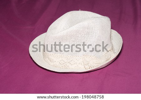 the lovely hat on purple fabric