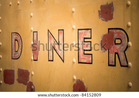 Diner sign on side of train dining car