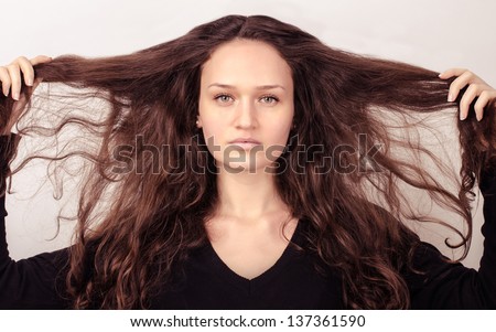 Beautiful woman with wild natural hair,messy and damaged hair