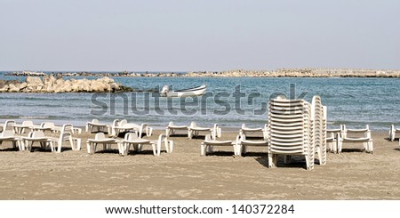 Boat, beach and many lounge chairs