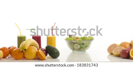 Table full of organic food,juices, smoothie ,healthy salad and fruits. Isolated on white