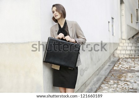 young business woman with business suitcase